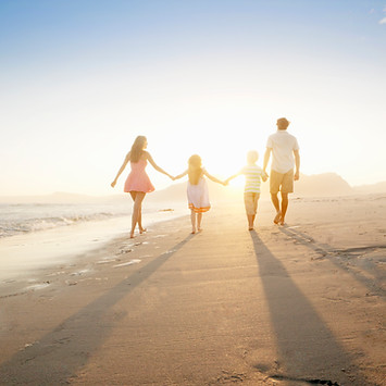 Family Walking On the Beach
